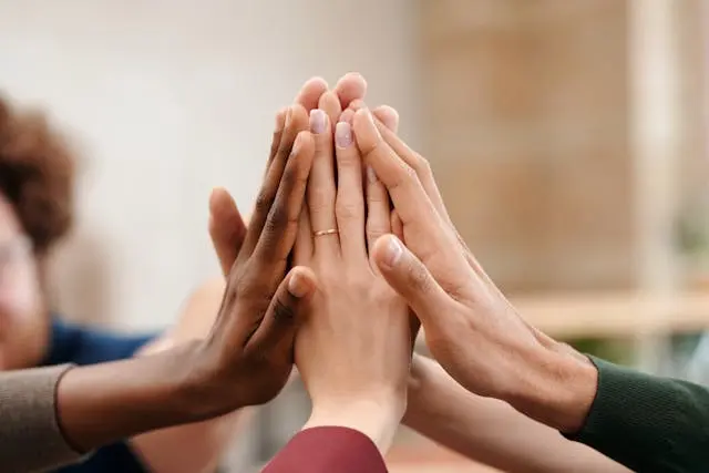 hands coming together in a high-five gesture psychiatric care